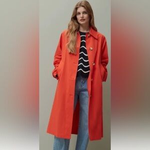 Piombo oversized orange rain coat. Size XS